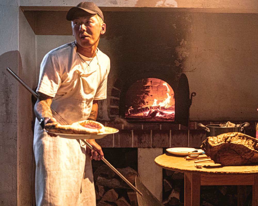 Pizza night by the wood-fired oven