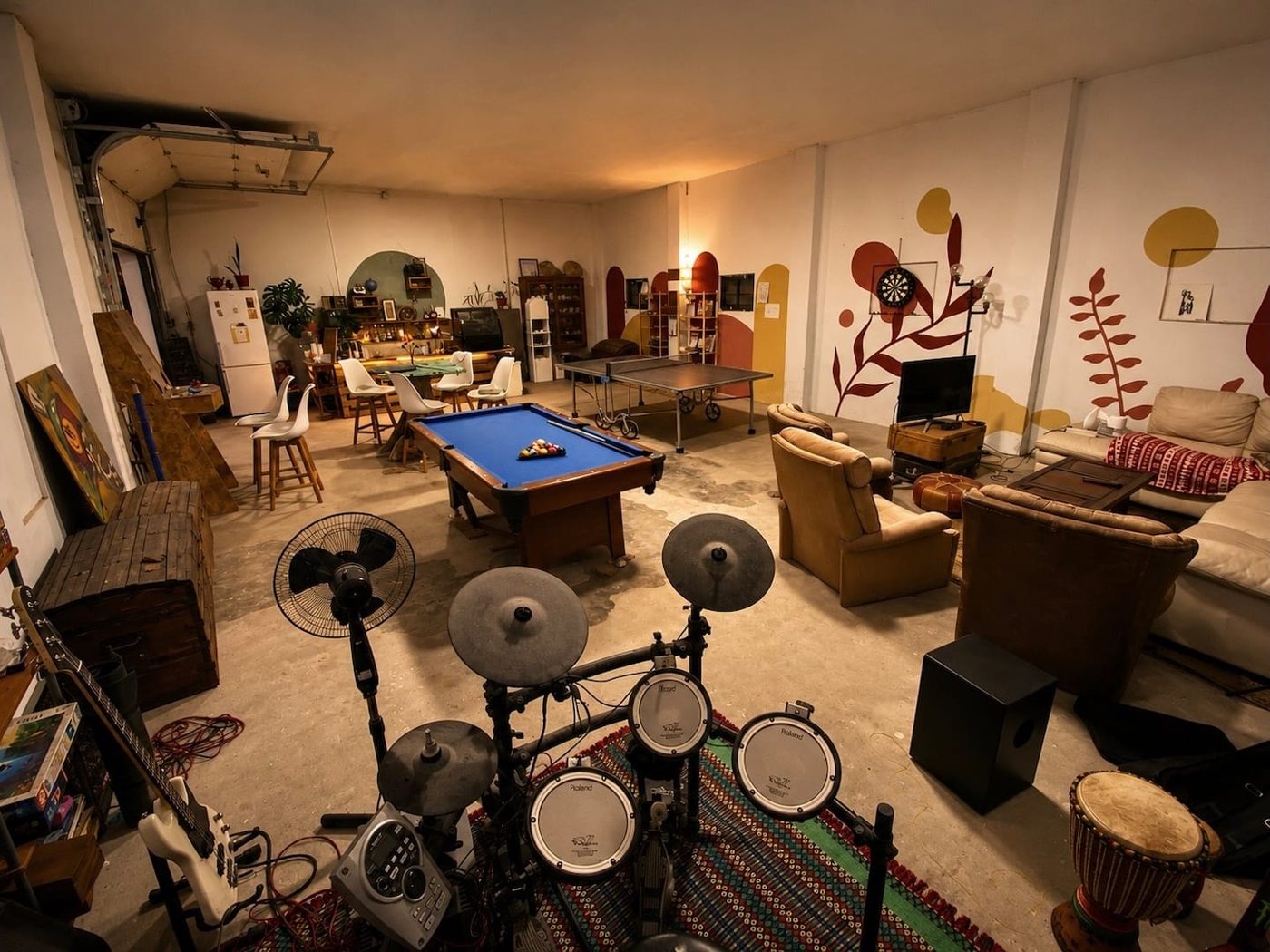 The common room: pool table, ping-pong, sofas and drums